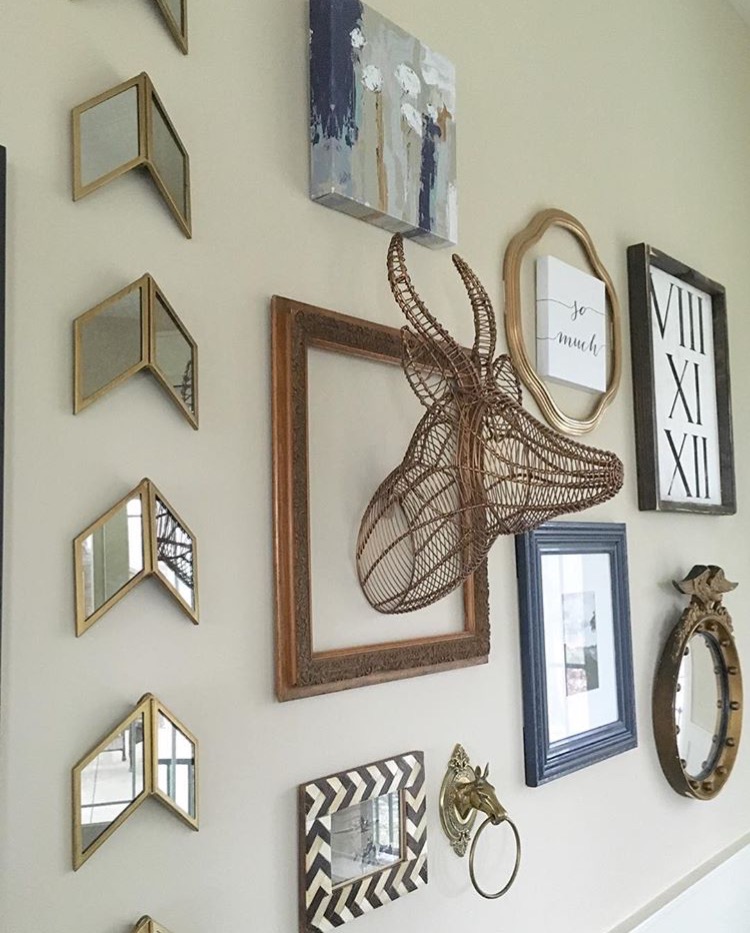 wall design with mirrors picture frames and other decorations