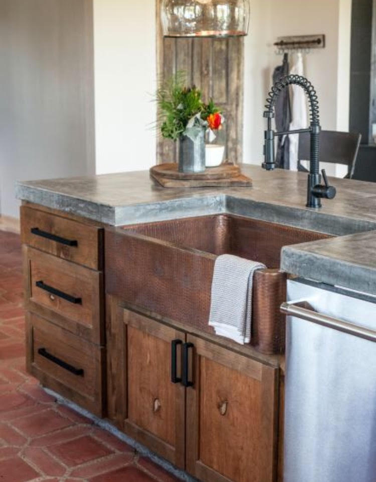 southern style kitchen with apron front kitchen sink and bronze finish faucet