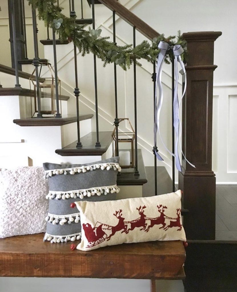 Staircase with garland and pillows