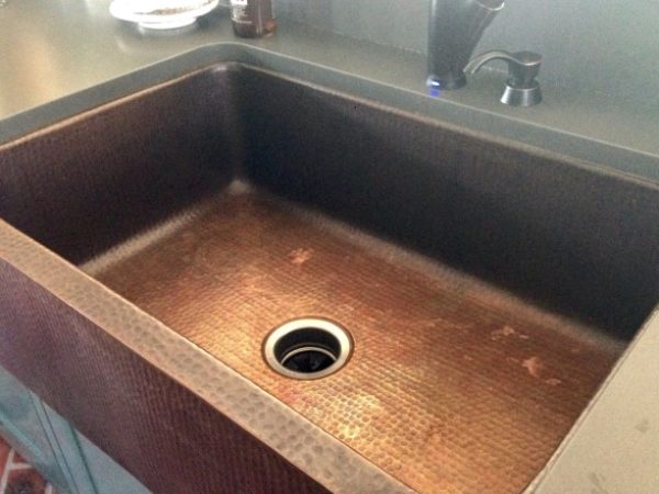 fully installed farmhouse apron hand hammered copper kitchen sink with gray counters