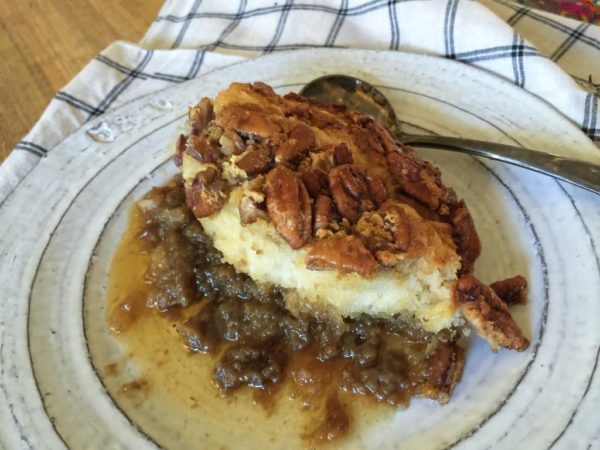maple-buttered pecan pie cobbler recipe on plate with spoon