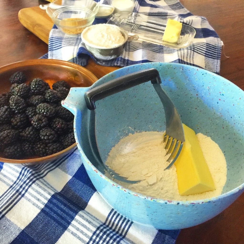 Blackberry Custard Cake ingredients, bowl of blackberries and a bowl of butter.