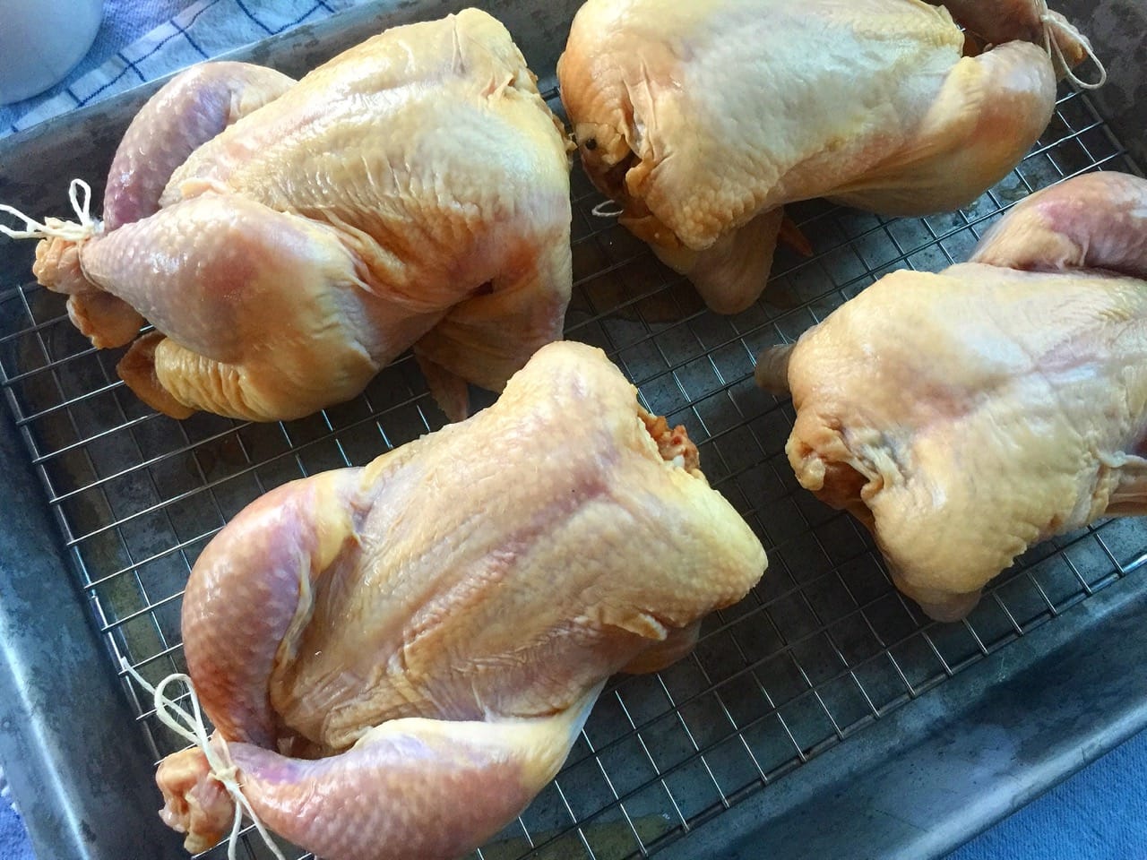 chickens on a tray ready for the oven