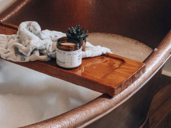 a copper tub with a diy tub tray