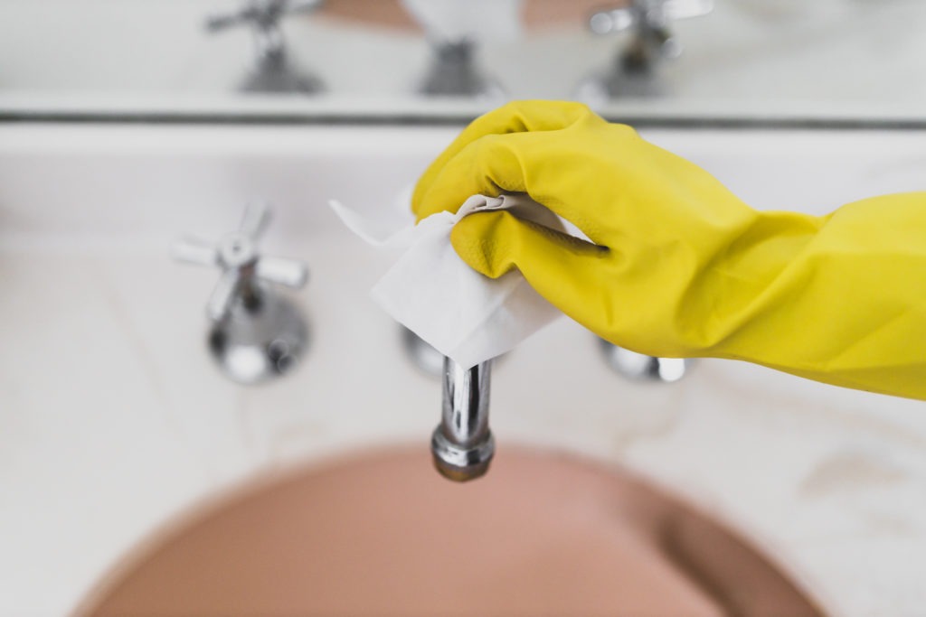 disinfecting sink with glove