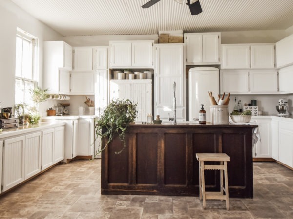 large white kitchen with vintage island