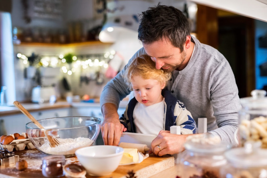 young family making gingerbread