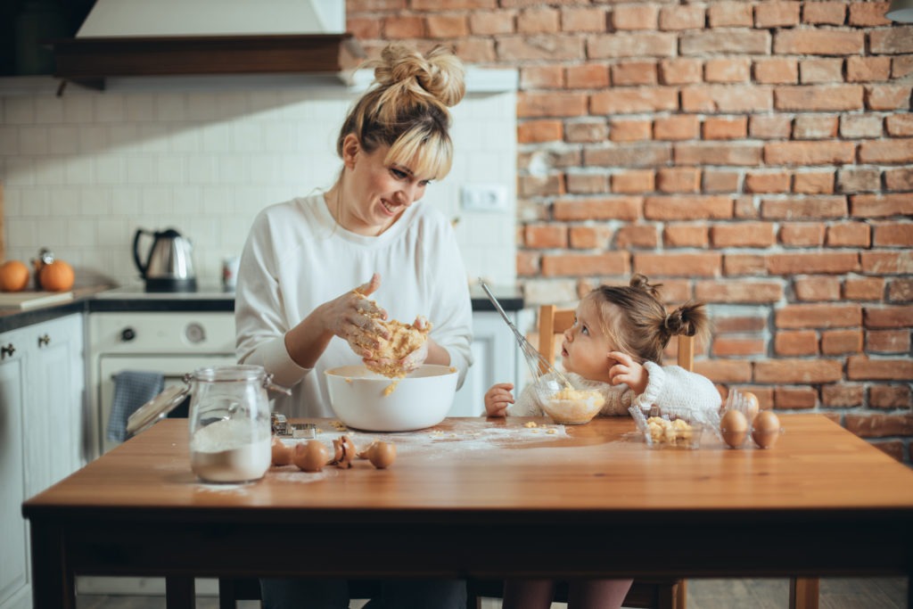 mother and daughter making bread