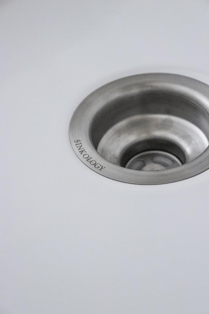 stainless steel sink drain in fireclay sink