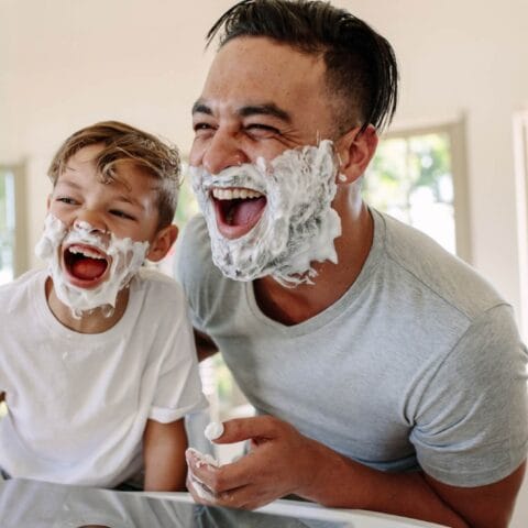 father shaving with son