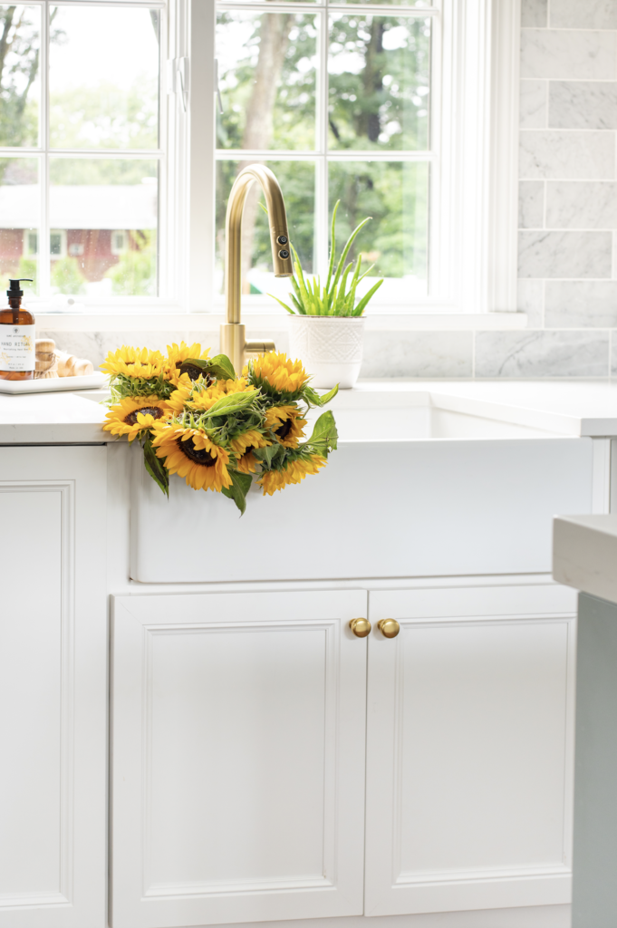 white fireclay sink with sunflowers in basin