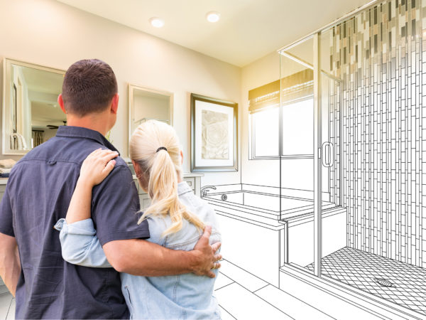 Couple looking at their bathroom remodel plans