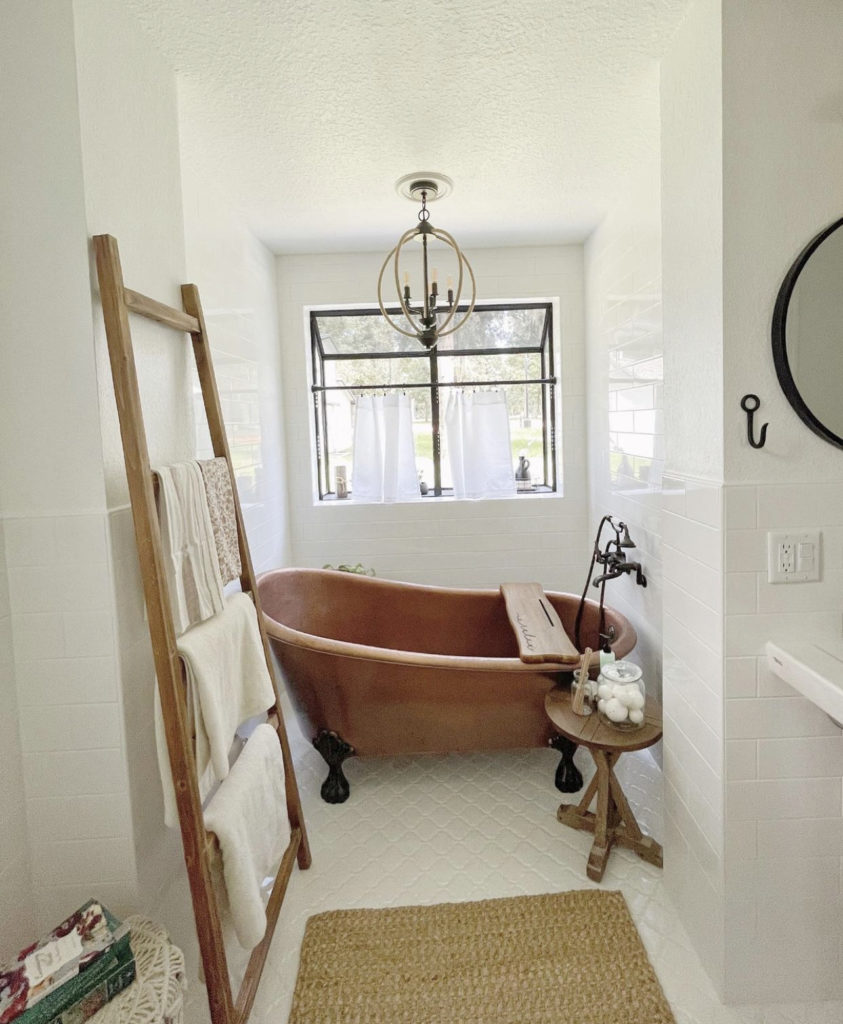 white bathroom with copper tub