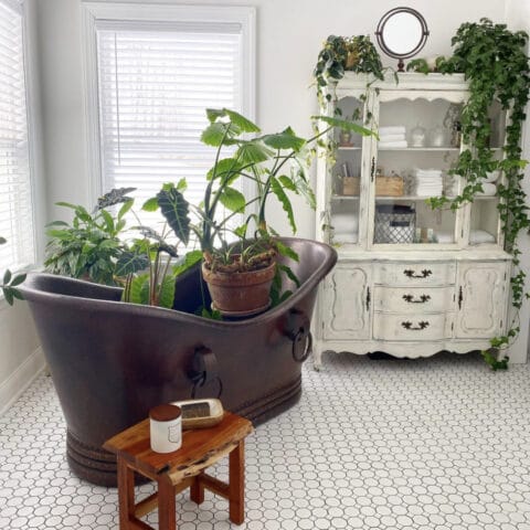 a copper sink full of plants