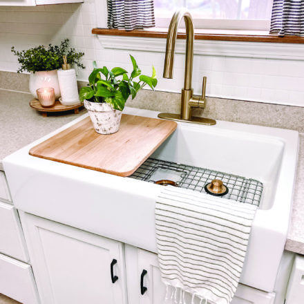 Josephine Workstation sink in white and tan kitchen