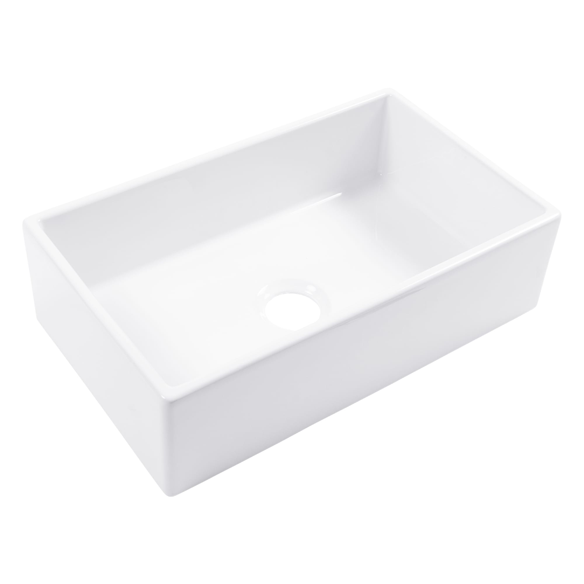 A white fireclay farmhouse kitchen sink.