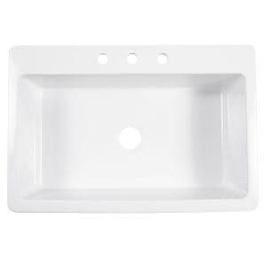 A white fireclay farmhouse drop-in kitchen sink.