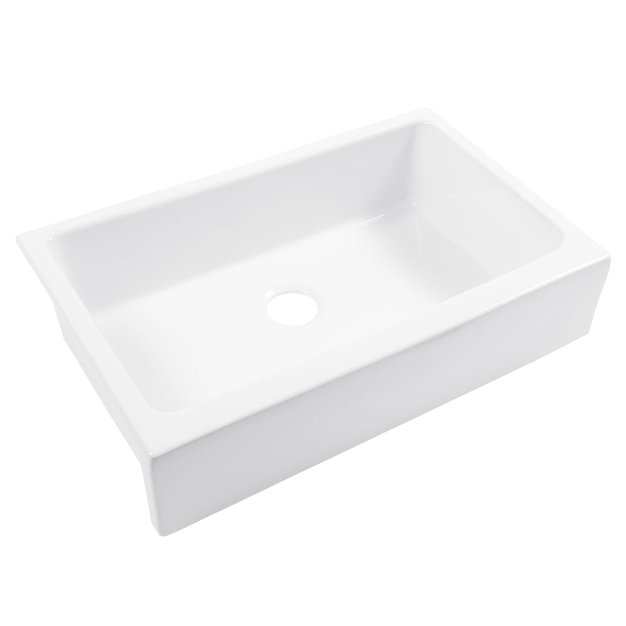 A white fireclay farmhouse kitchen sink.