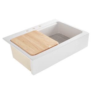 A glossy white rectangular Quick-Fit® drop-in workstation farmhouse sink made in fireclay with 3 faucet holes, wood cutting board, stainless steel bottom grid and a 3.5" drain hole.