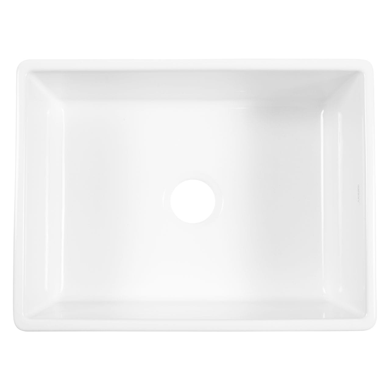 A white fireclay farmhouse kitchen sink.