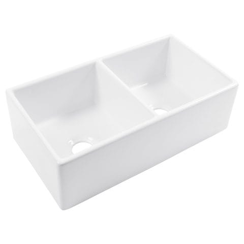 A glossy white rectangular double bowl undermount farmhouse sink made in fireclay.