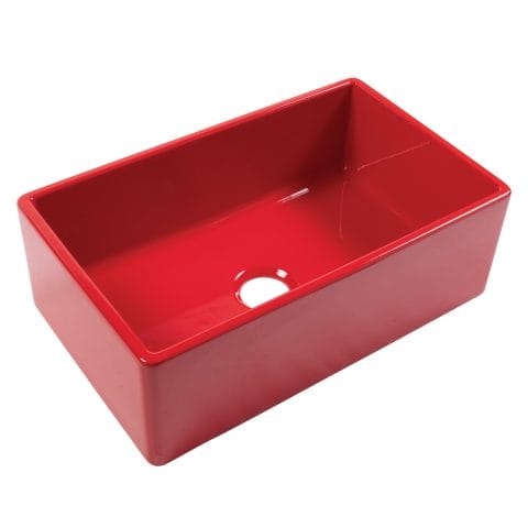 A glossy red rectangular undermount farmhouse sink made in fireclay with a 3.5" drain hole.