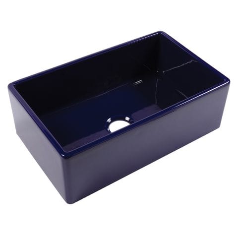 A glossy royal blue rectangular undermount farmhouse sink made in fireclay with a 3.5" drain hole.