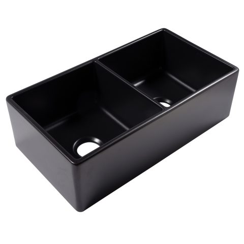 A matte black rectangular double bowl undermount farmhouse sink made in fireclay with a 3.5" drain hole.