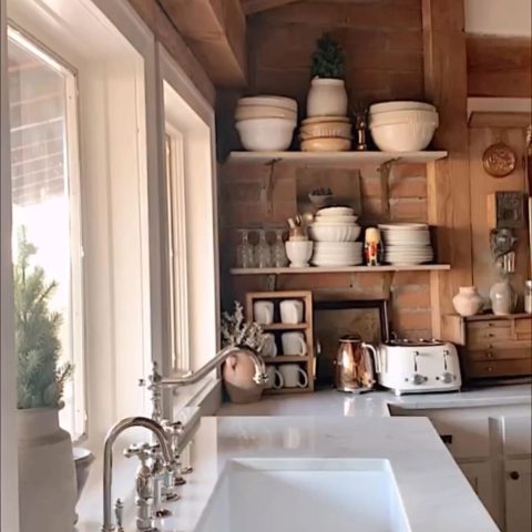 A glossy white rectangular undermount sink made in fireclay in a classic home kitchen.
