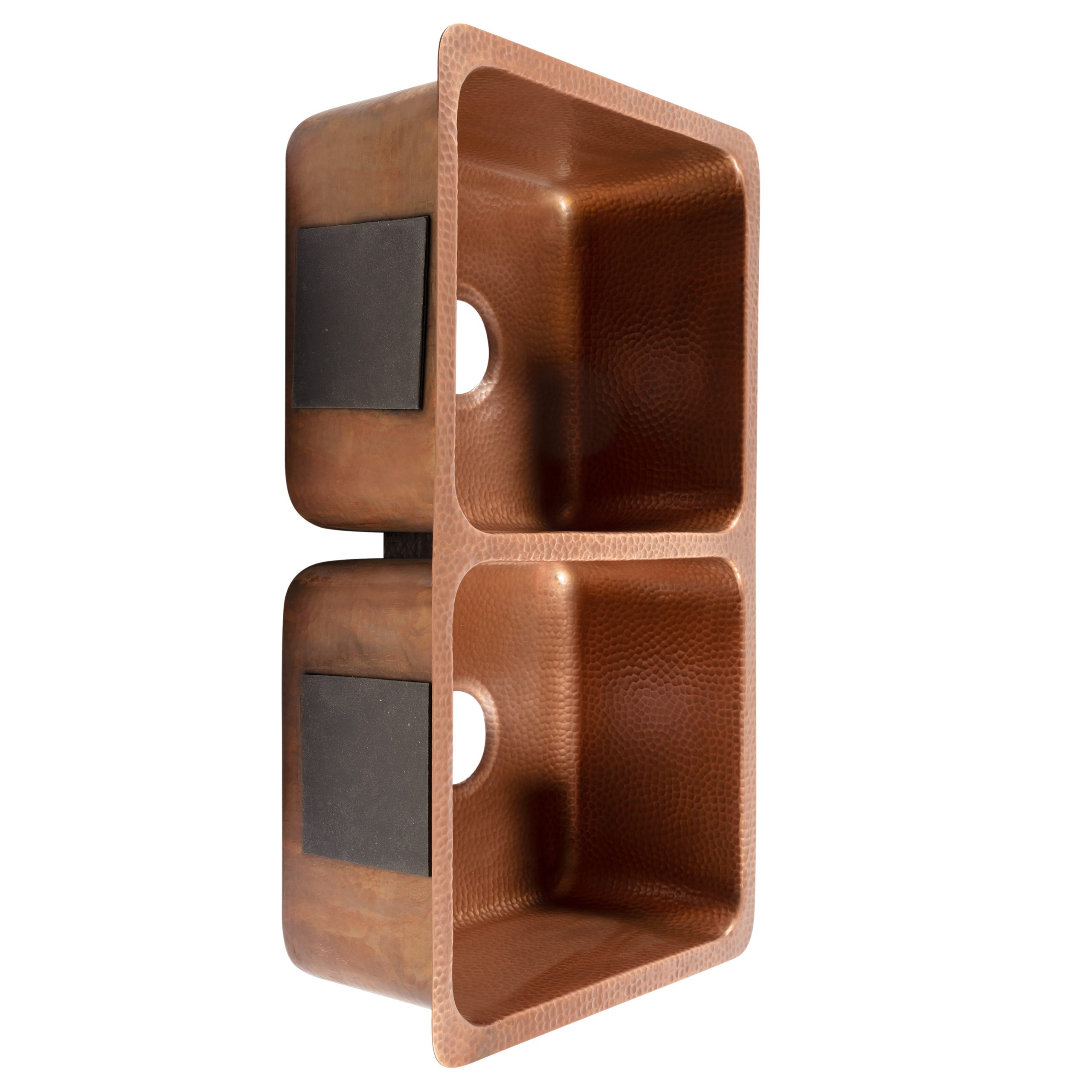 A copper rectangular undermount double basin sink.