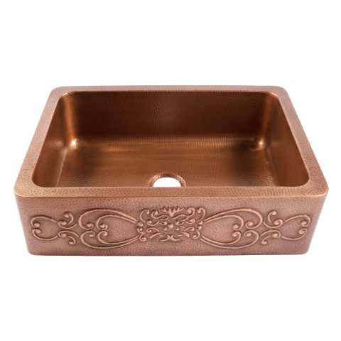 A copper rectangular undermount farmhouse sink.