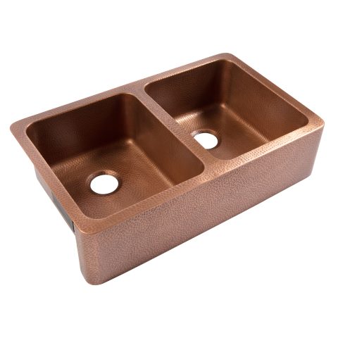 A copper rectangular undermount double basin farmhouse sink.
