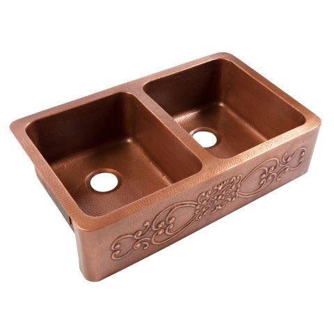 A copper rectangular undermount double basin farmhouse sink.