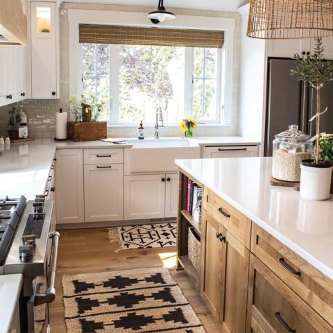 a farmhouse kitchen with fireclay sink