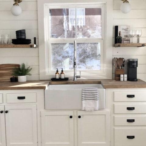 a white kitchen sink in a cabin kitchen