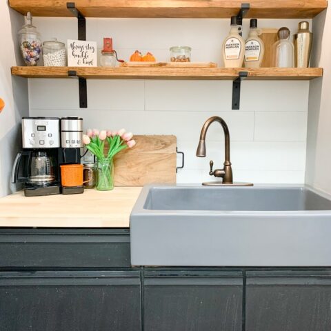 a matte gray fireclay sink in a kitchenette
