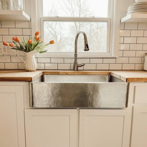 a crafted stainless steel farmhouse kitchen sink