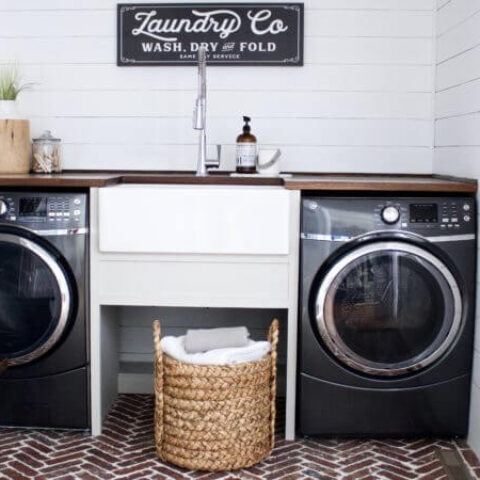 a laundry room with a white fireclay sink
