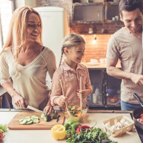 our journey collection banner with a family prepping food in a kitchen.