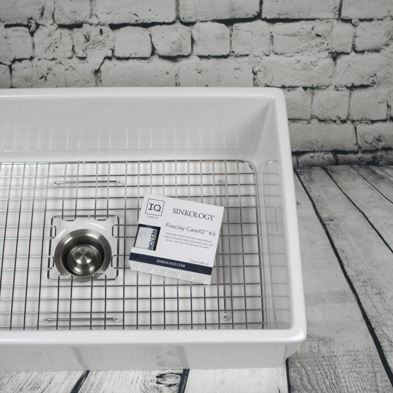 Fireclay CareIQ Kit in a fireclay sink