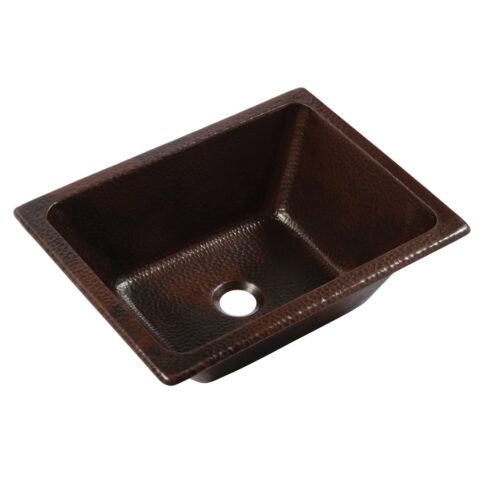 A hand hammered copper dual mount bathroom sink.
