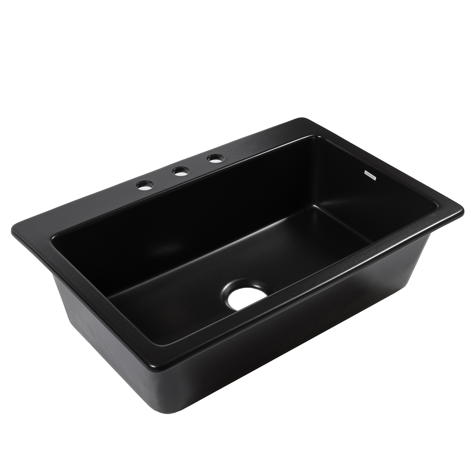 A matte black fireclay drop-in kitchen sink.