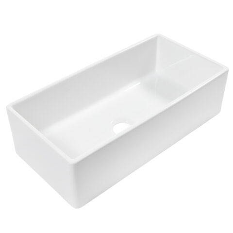 a large white fireclay kitchen sink