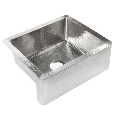 A hand hammered stainless steel farmhouse kitchen sink.