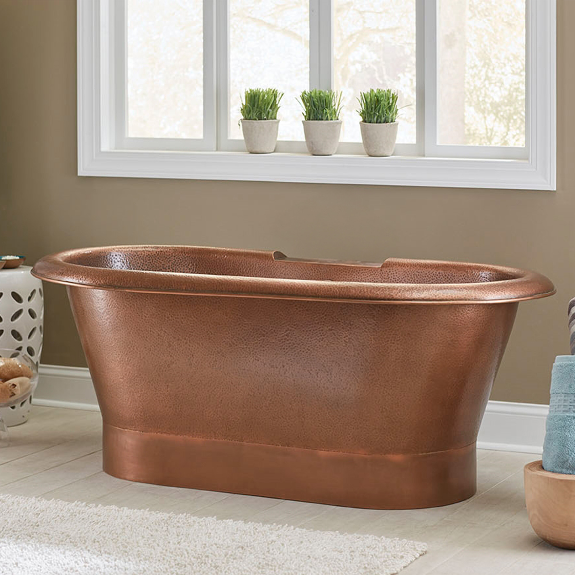 A hand hammered copper bath tub.