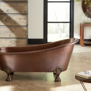 A hand hammered copper claw foot bath tub