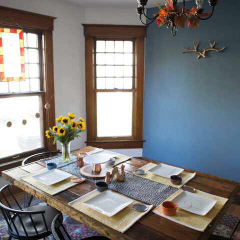 a dining room table setup for Thanksgiving Day.