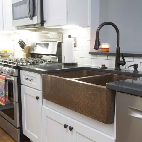 a copper farmhouse sink with double basins