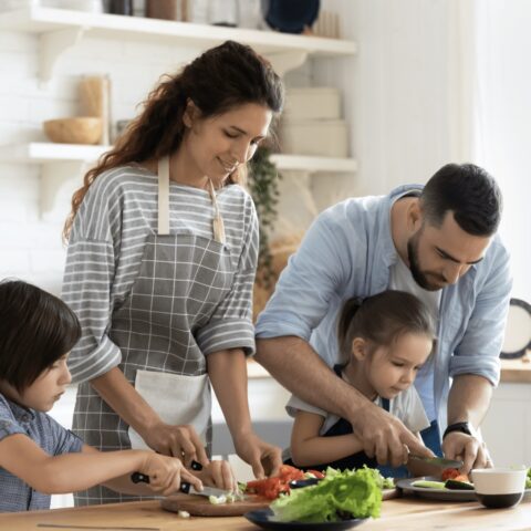 a family prepping food in the kitchen