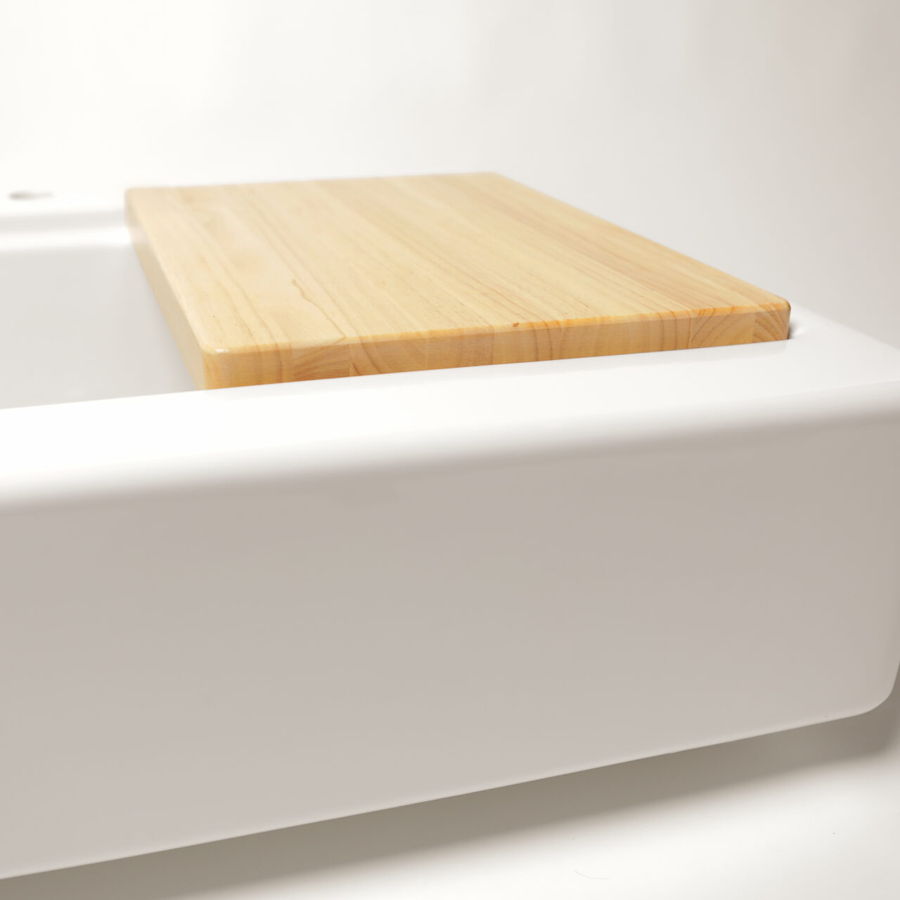 Parker 34" crisp white fireclay farmhouse workstation sink with bottom grid and cutting board